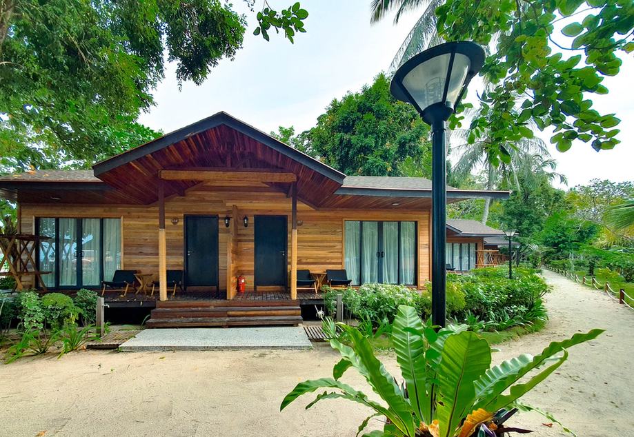 Timber chalet with a porch and garden path at Borneo Divers Mabul Resort (placeholder, to recheck when the photo is replaced)